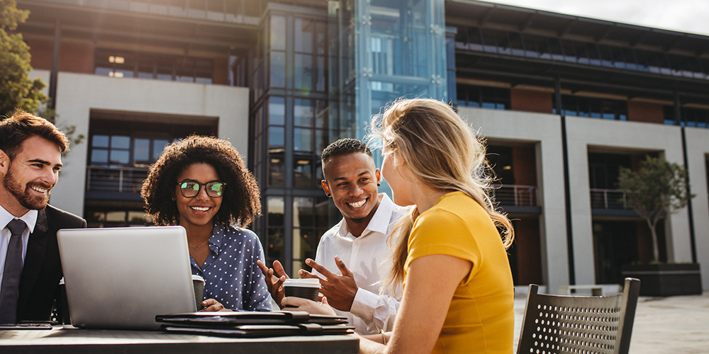 Young coworkers using influencing skills in a meeting